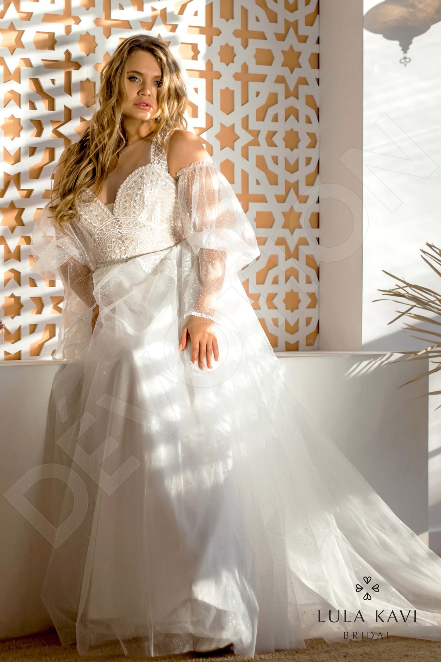 Kifaya Illusion back A-line Long sleeve Wedding Dress Front